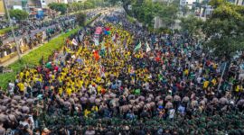 This aerial picture shows students protesting to demand a reduction in fuel prices and the dissolution of the free meal program, which they consider to be a hotbed of corruption, in Jakarta on June 12, 2026. (Photo by BAY ISMOYO / AFP)