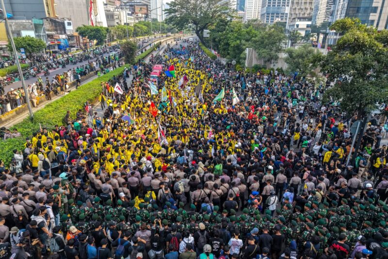 This aerial picture shows students protesting to demand a reduction in fuel prices and the dissolution of the free meal program, which they consider to be a hotbed of corruption, in Jakarta on June 12, 2026. (Photo by BAY ISMOYO / AFP)